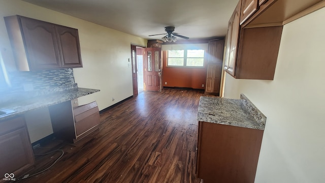 2620 Wicker Rd, Indianapolis, IN 46217 - kitchen with dark hardwood / wood-style floors, light stone countertops, backsplash, and ceiling fan