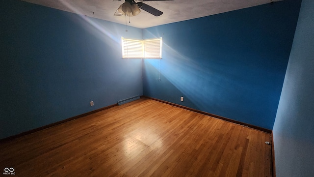 2620 Wicker Rd, Indianapolis, IN 46217 - spare room with ceiling fan and hardwood / wood-style flooring