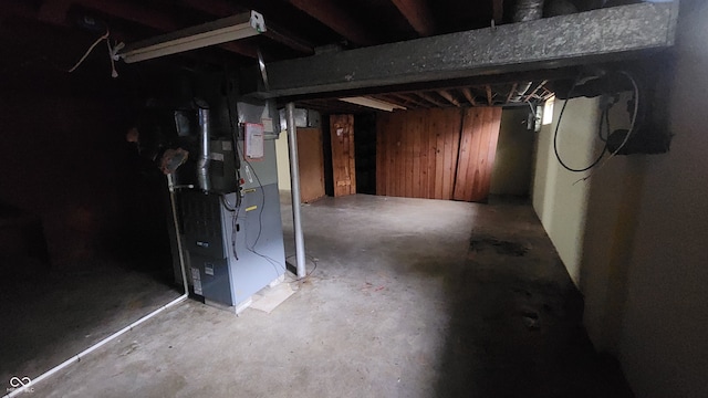 2620 Wicker Rd, Indianapolis, IN 46217 - basement with wood walls and heating unit