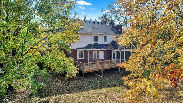 rear view of property with a deck