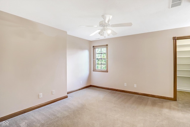 6640 Greenridge Dr, Indianapolis, IN 46278 - spare room with visible vents, a ceiling fan, baseboards, and light colored carpet