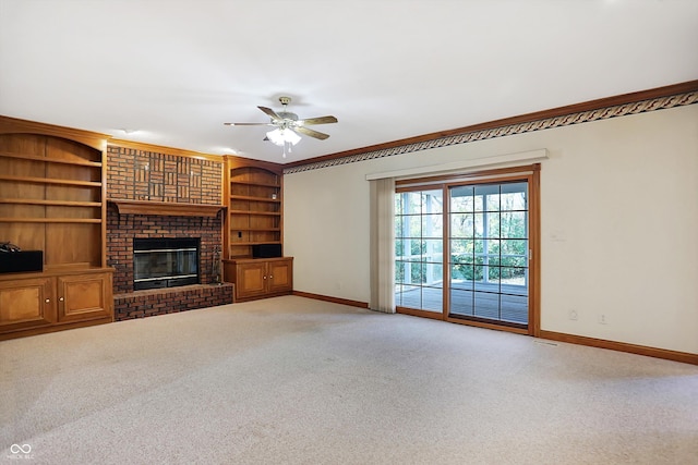 6640 Greenridge Dr, Indianapolis, IN 46278 - unfurnished living room with baseboards, a brick fireplace, ceiling fan, and light carpet