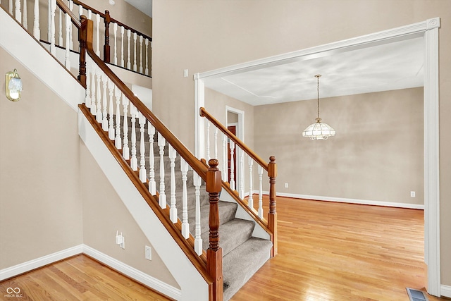 stairway featuring hardwood / wood-style floors