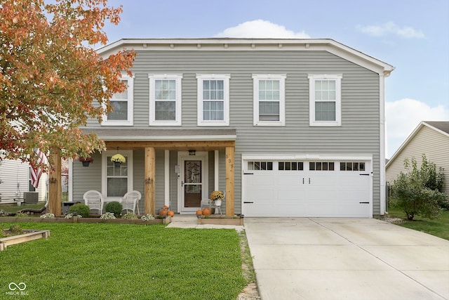 view of front of house featuring a front yard, a garage, cooling unit, and a porch