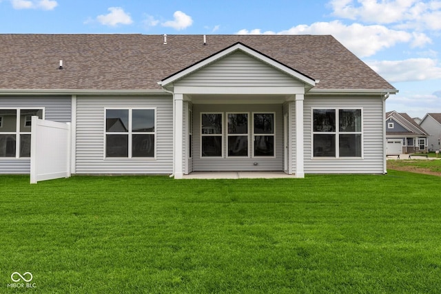 back of property featuring a yard and a patio area