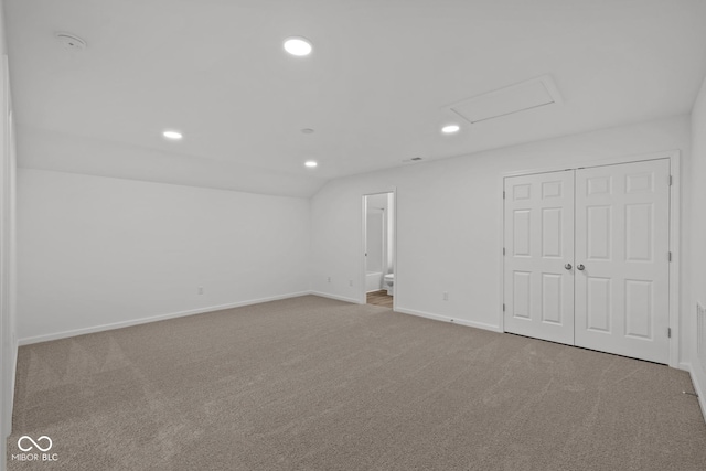 unfurnished room featuring light colored carpet