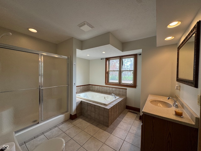 full bathroom featuring plus walk in shower, toilet, tile patterned flooring, vanity, and a textured ceiling