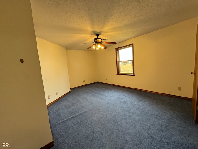 carpeted empty room with a textured ceiling and ceiling fan