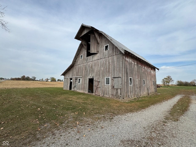 view of property exterior featuring a lawn