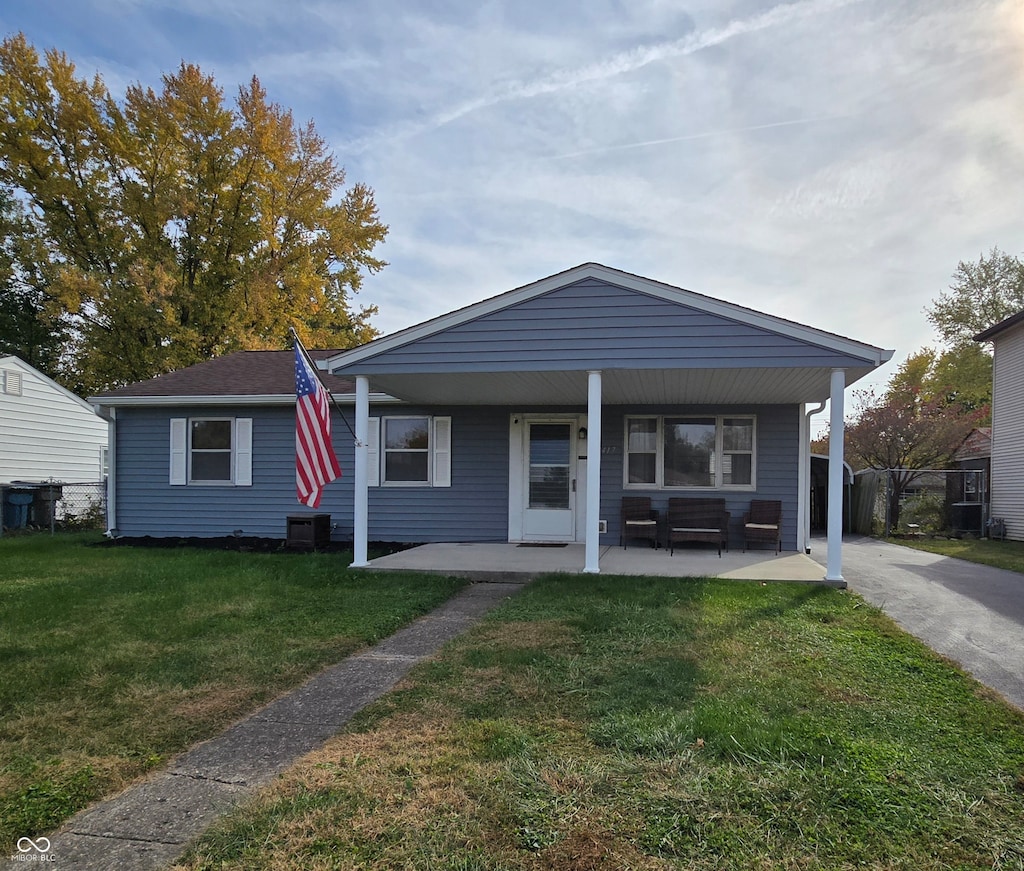 view of front facade with a front lawn and a porch