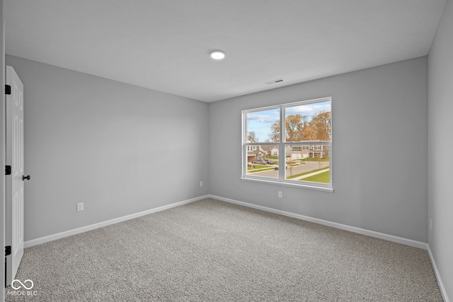 unfurnished room with carpet flooring