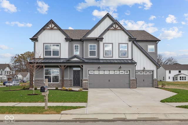 view of front of house with a garage and a front lawn