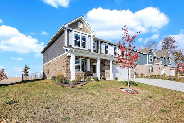 craftsman-style house featuring a front yard and a garage