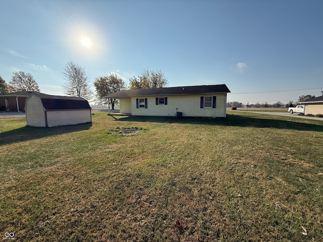 exterior space featuring a shed and a yard