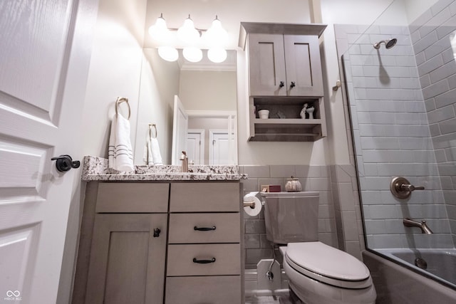 full bathroom with tiled shower / bath combo, vanity, tile walls, and toilet