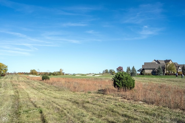 view of yard with a rural view