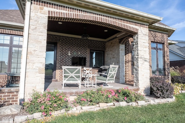 view of exterior entry featuring a porch