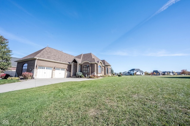 view of front of home with a garage and a front yard