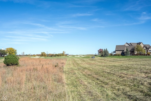 view of yard with a rural view