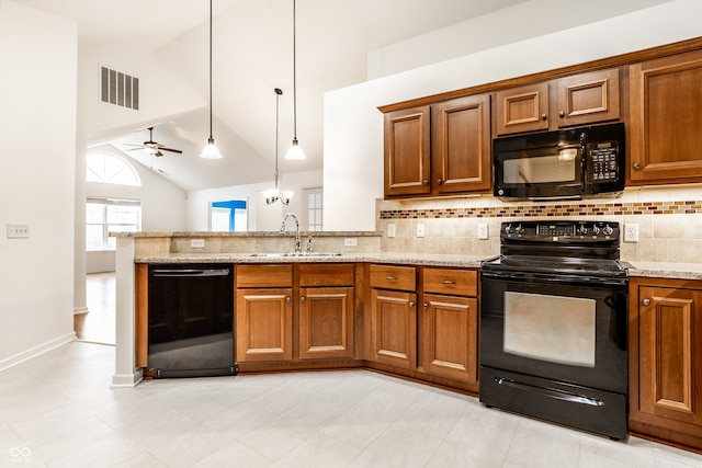 kitchen with sink, hanging light fixtures, high vaulted ceiling, black appliances, and ceiling fan with notable chandelier