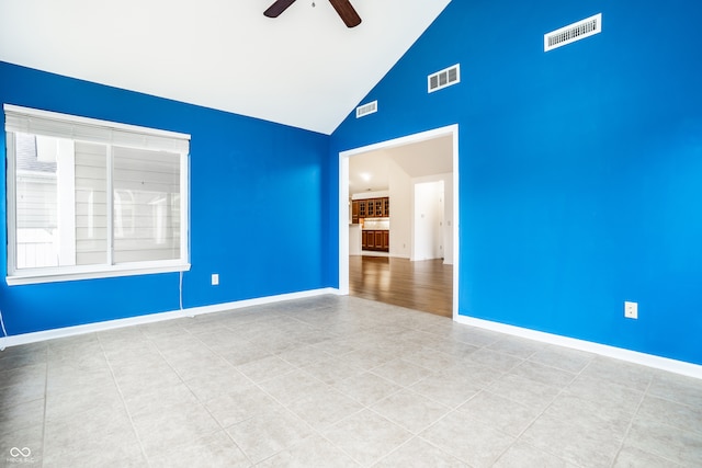 unfurnished room featuring high vaulted ceiling and ceiling fan