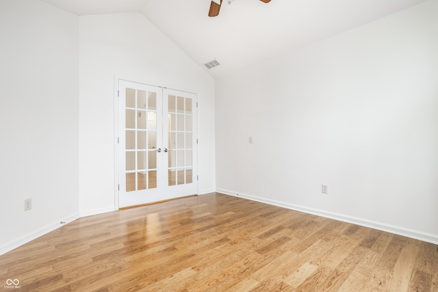 unfurnished room featuring ceiling fan, vaulted ceiling, light hardwood / wood-style flooring, and french doors