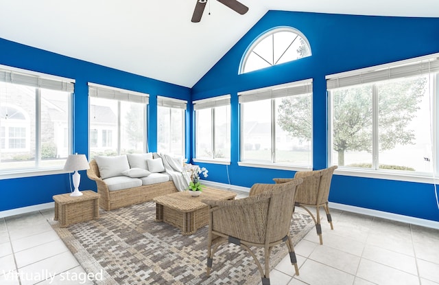 sunroom / solarium with ceiling fan, a healthy amount of sunlight, and lofted ceiling