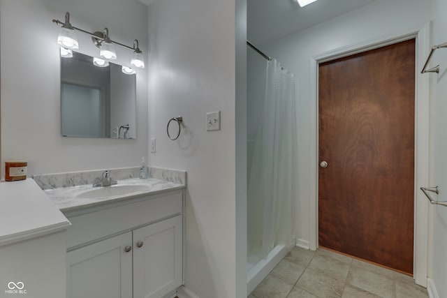 bathroom featuring vanity and curtained shower