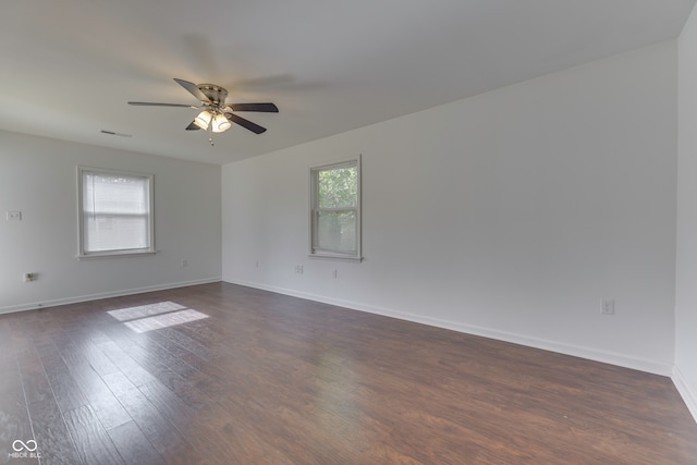 unfurnished room featuring ceiling fan and dark hardwood / wood-style flooring