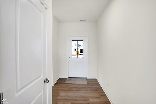 doorway to outside featuring wood-type flooring