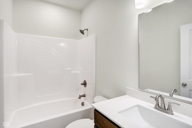 full bathroom featuring  shower combination, vanity, and toilet