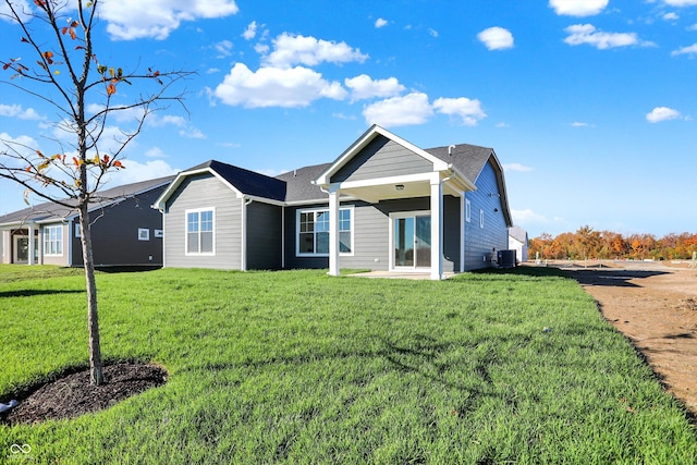 back of house with a yard