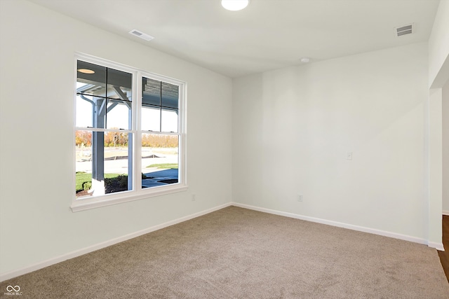 spare room featuring carpet flooring