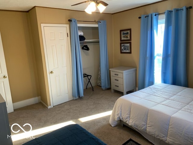 bedroom with light carpet, a closet, and ceiling fan