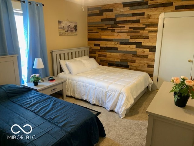 bedroom with light carpet and wooden walls