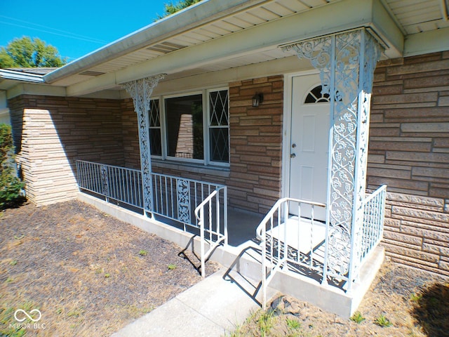 doorway to property featuring a porch