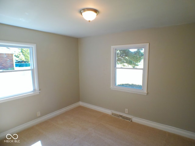 view of carpeted spare room