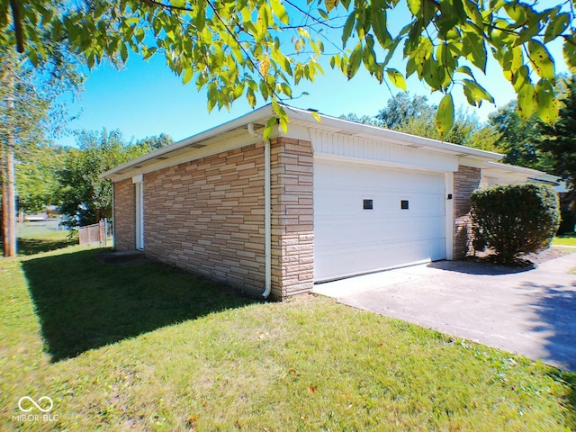 garage featuring a yard