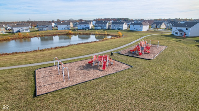 exterior space featuring a water view and a playground