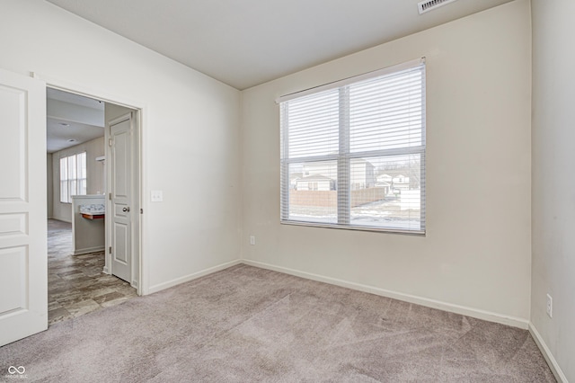 view of carpeted spare room