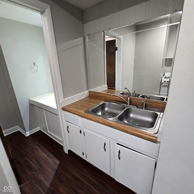 bathroom featuring vanity and hardwood / wood-style flooring