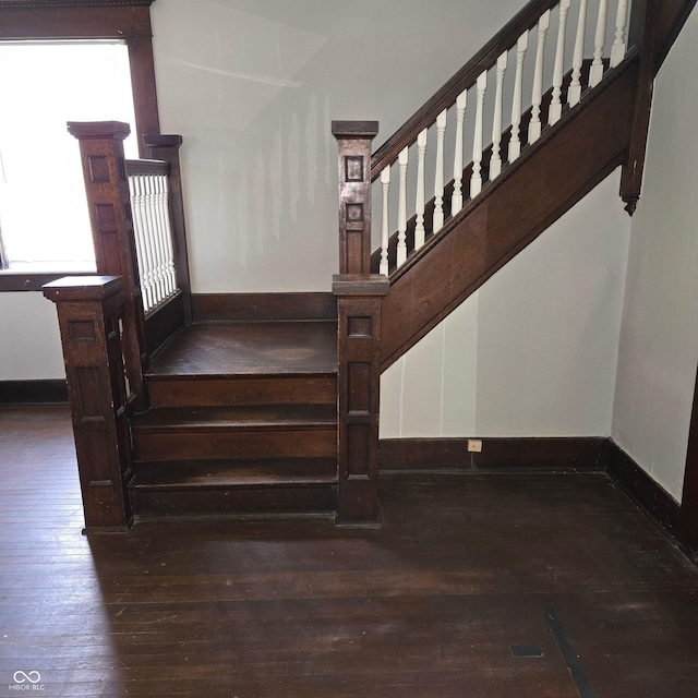 stairs featuring wood-type flooring