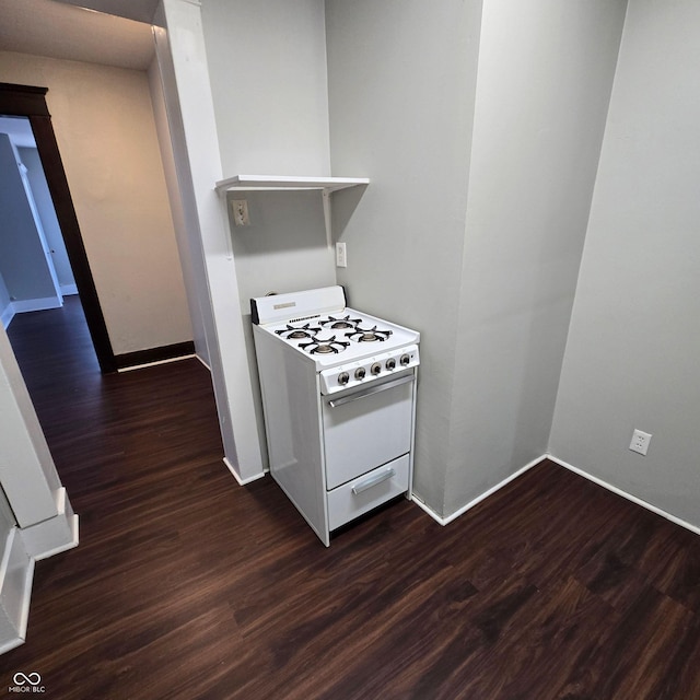 kitchen with dark wood-type flooring and white stove