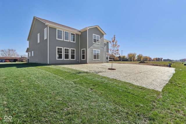 rear view of house with a lawn