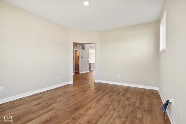 empty room with wood-type flooring