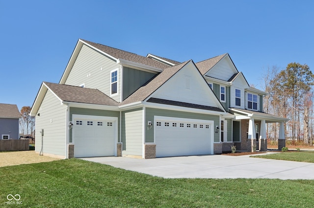 view of front of home with a garage and a front yard