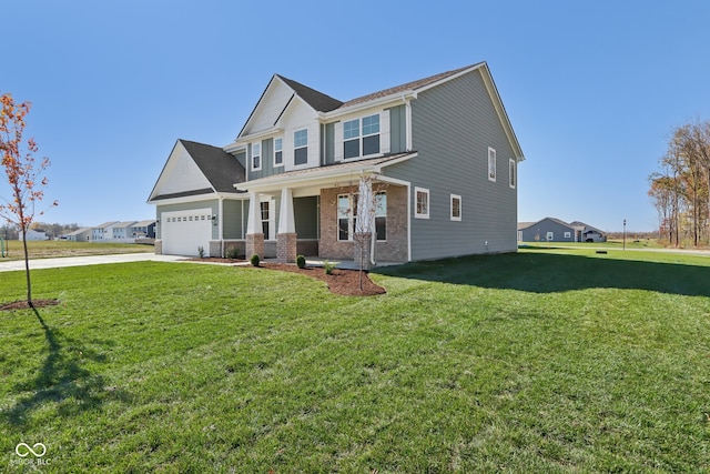 view of front of property with a porch, a front yard, and a garage