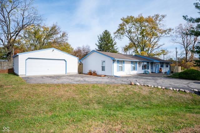 ranch-style house with a front yard and a garage