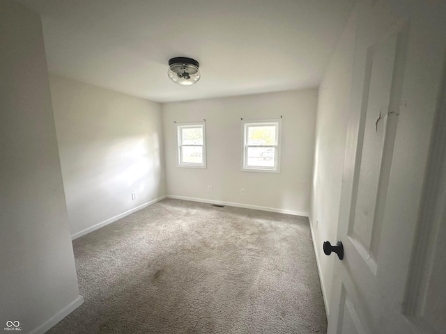 spare room featuring carpet flooring