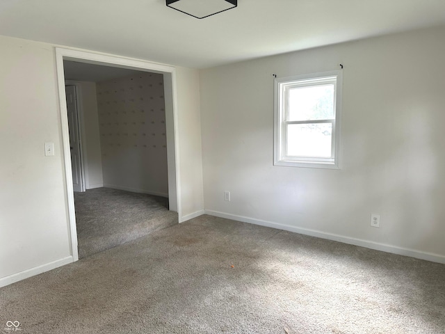 unfurnished room featuring carpet flooring